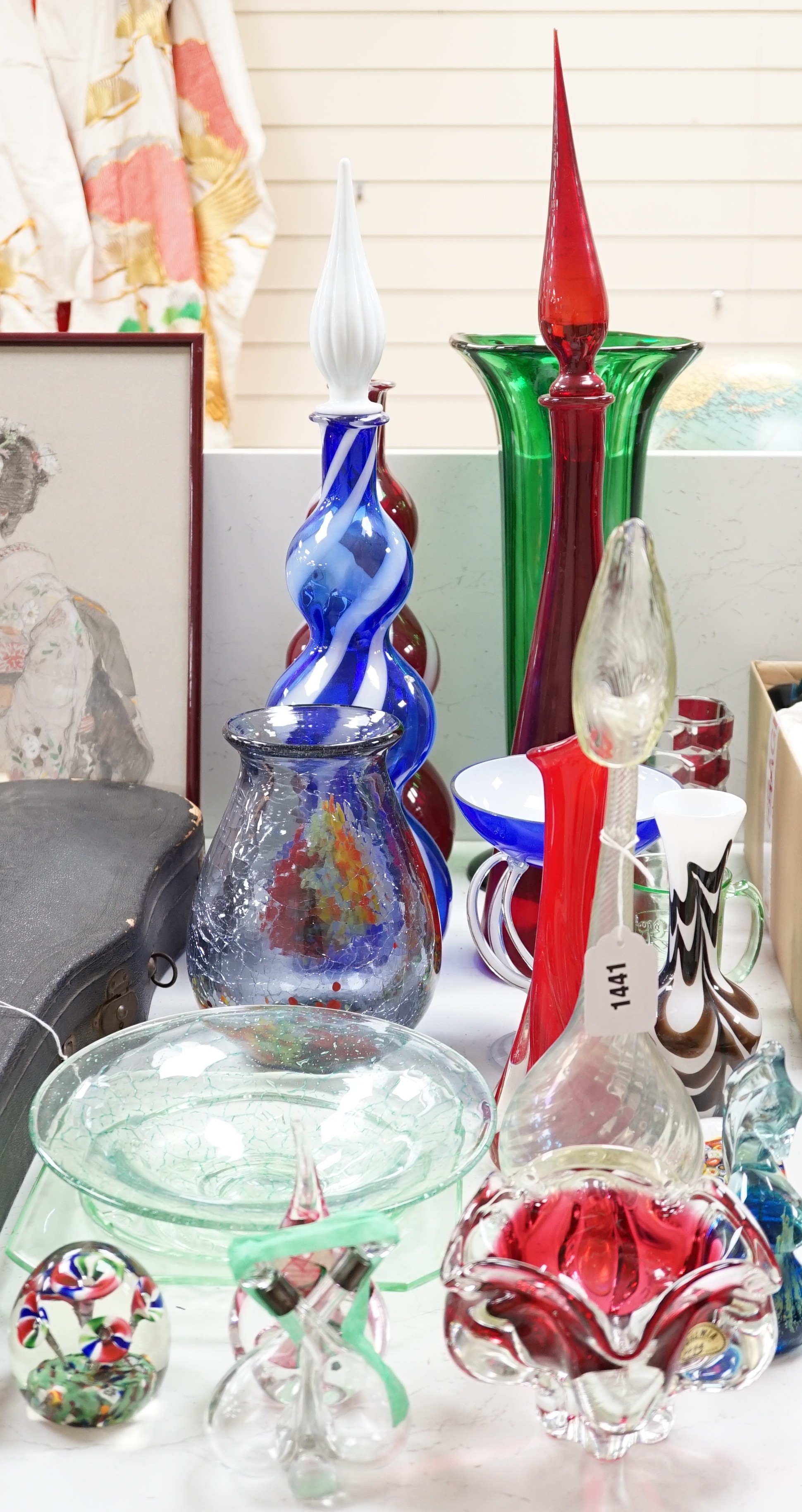 A large group of mixed art glass and other coloured glass vases, bowls, paperweights and two stoppered bottles etc, tallest 65cms high